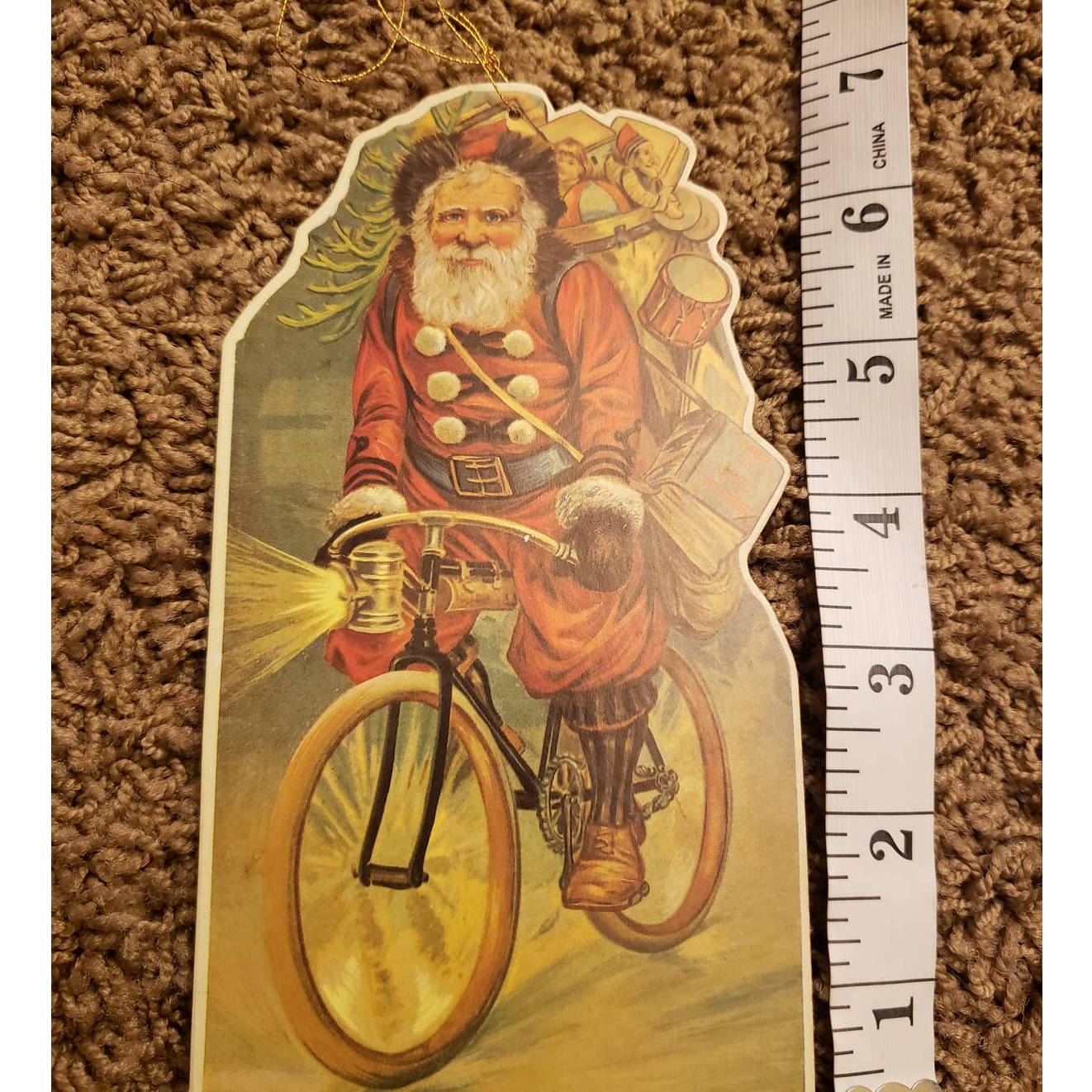 Vintage 1985 Merrimack Santa Bicycle Christmas Die Cut Hanging Card Ornament