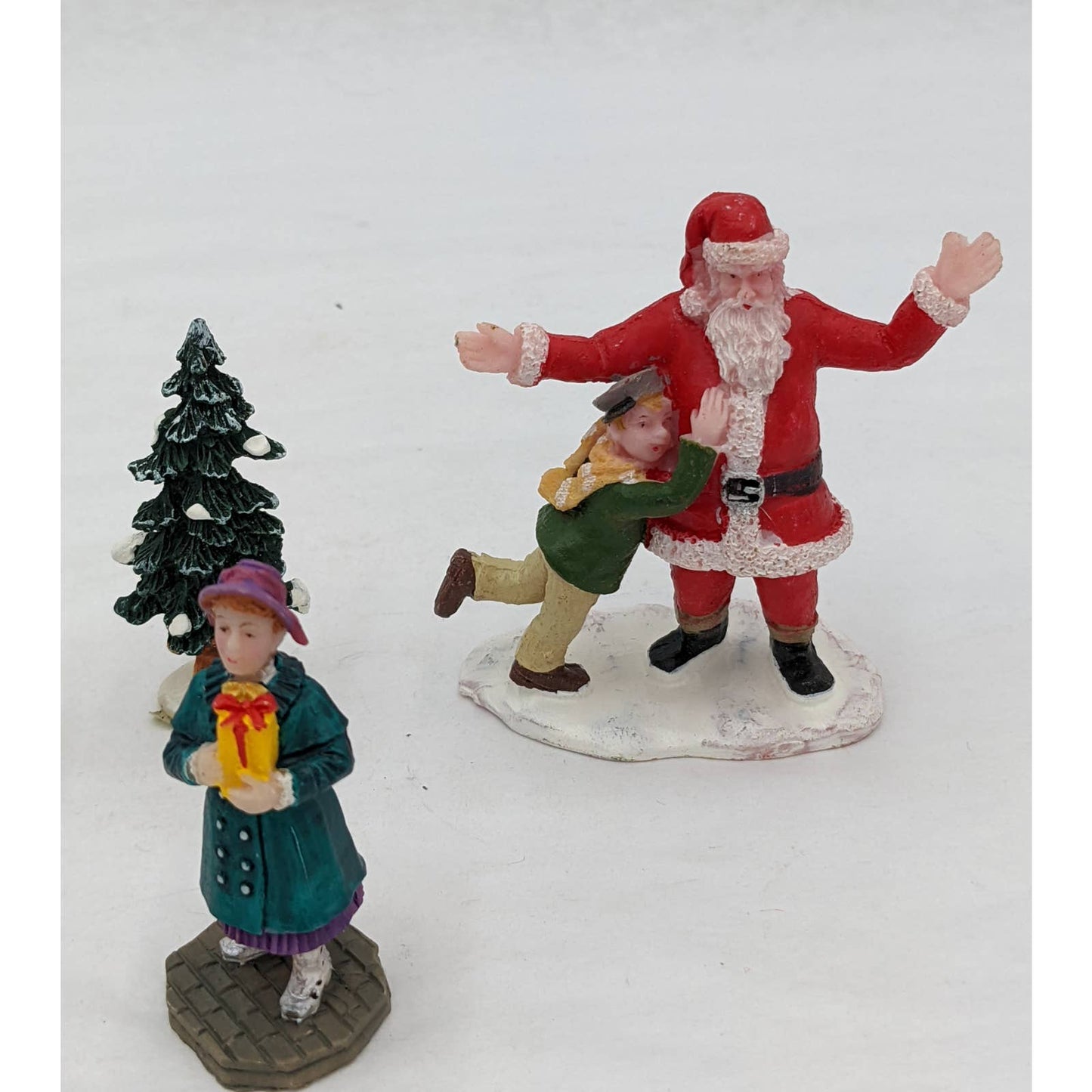 Lemax Christmas Figurines Hugging Santa Claus Tree